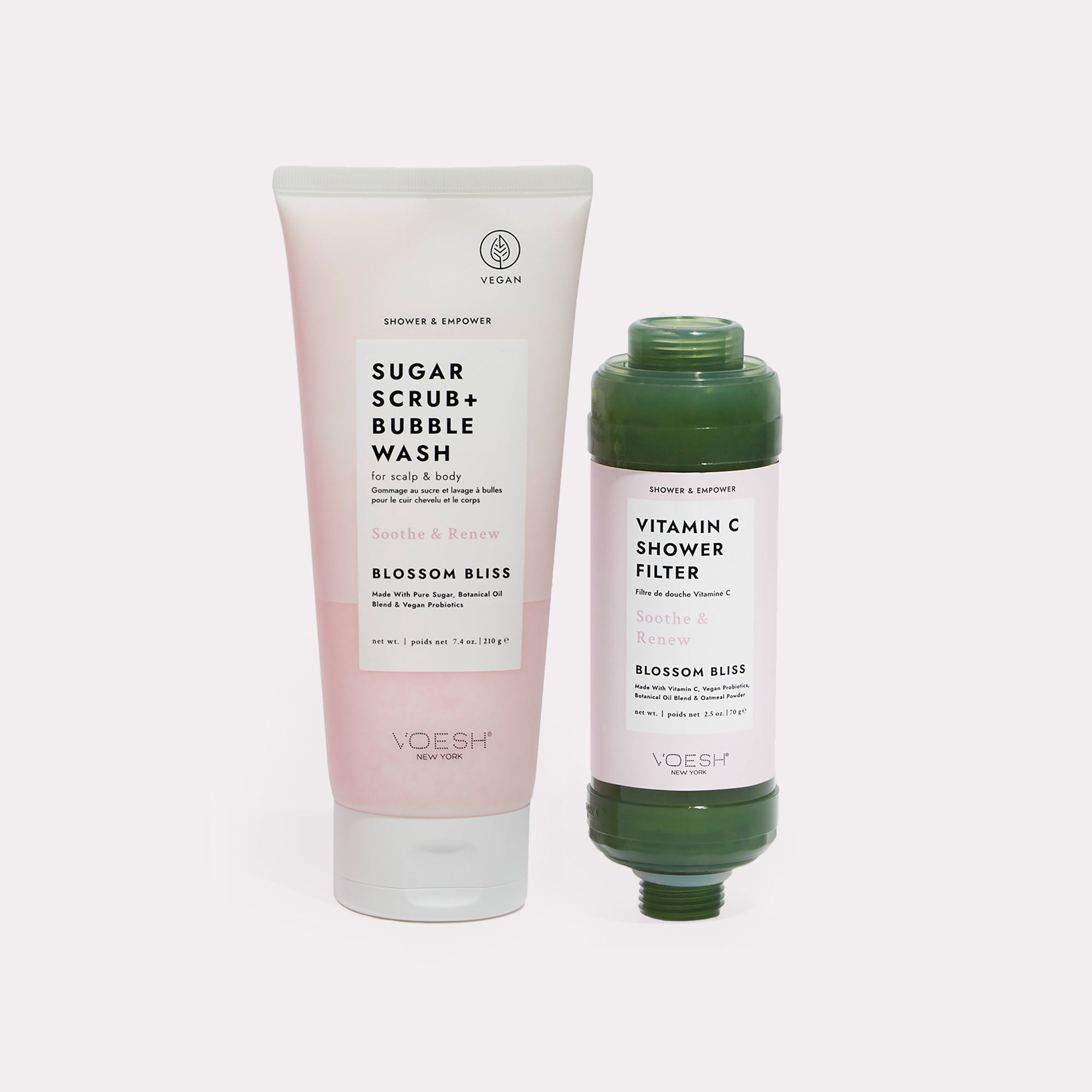 Blossom Bliss Shower & Empower Duo - Sugar scrub and shower filter on gray background